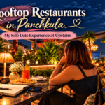 Rooftop restaurants in Panchkula featuring Upstairs rooftop ambience, city view, dinner table, greenery and warm evening lights